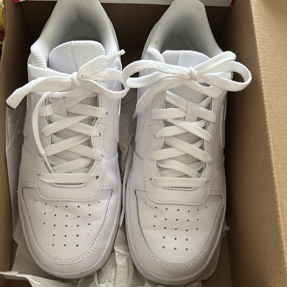Nike White Sneakers with Smooth Upper and Comfortable Fit